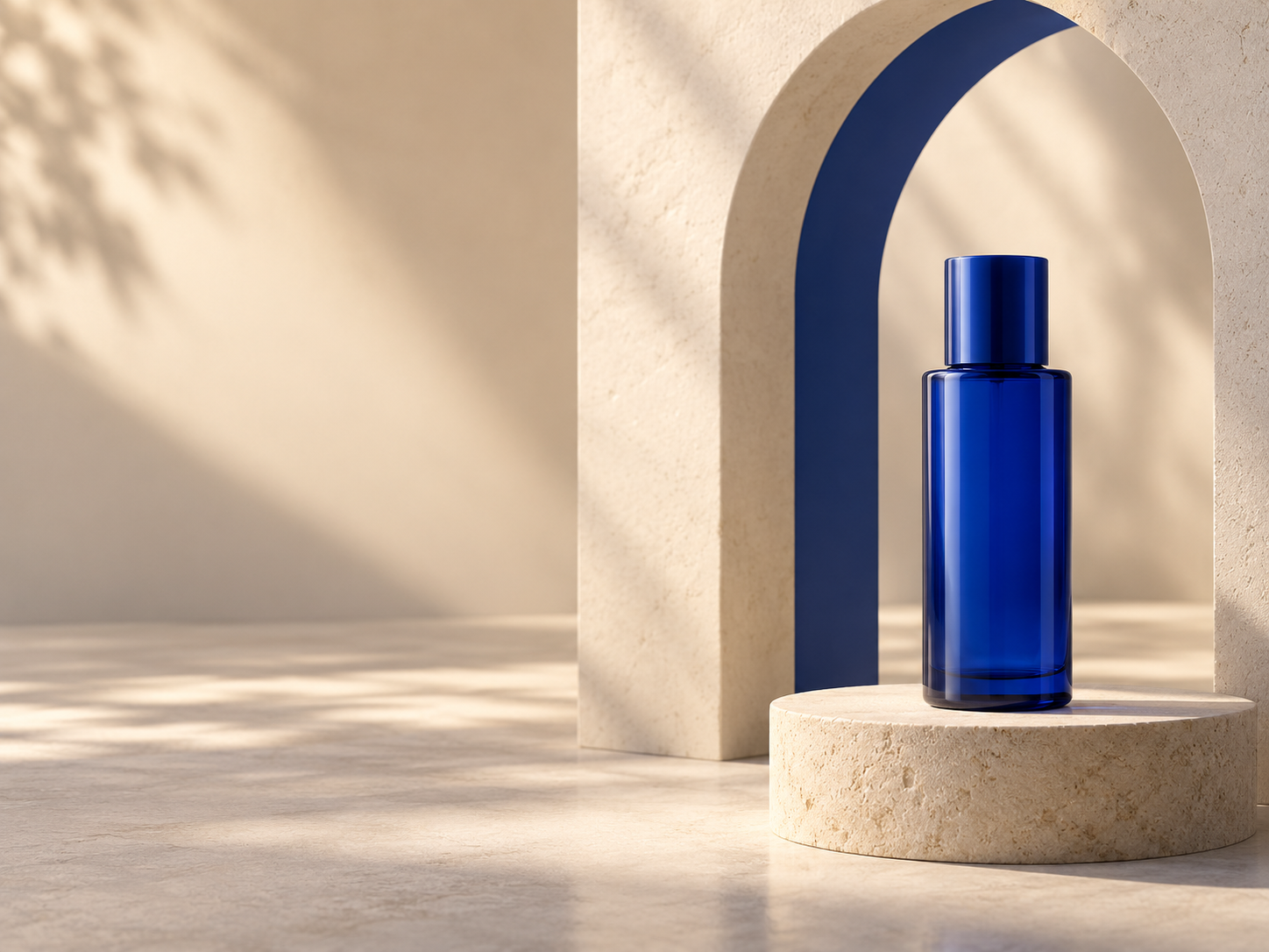 An unbranded blue skincare bottle on a stone plinth beneath a cream architectural arch.